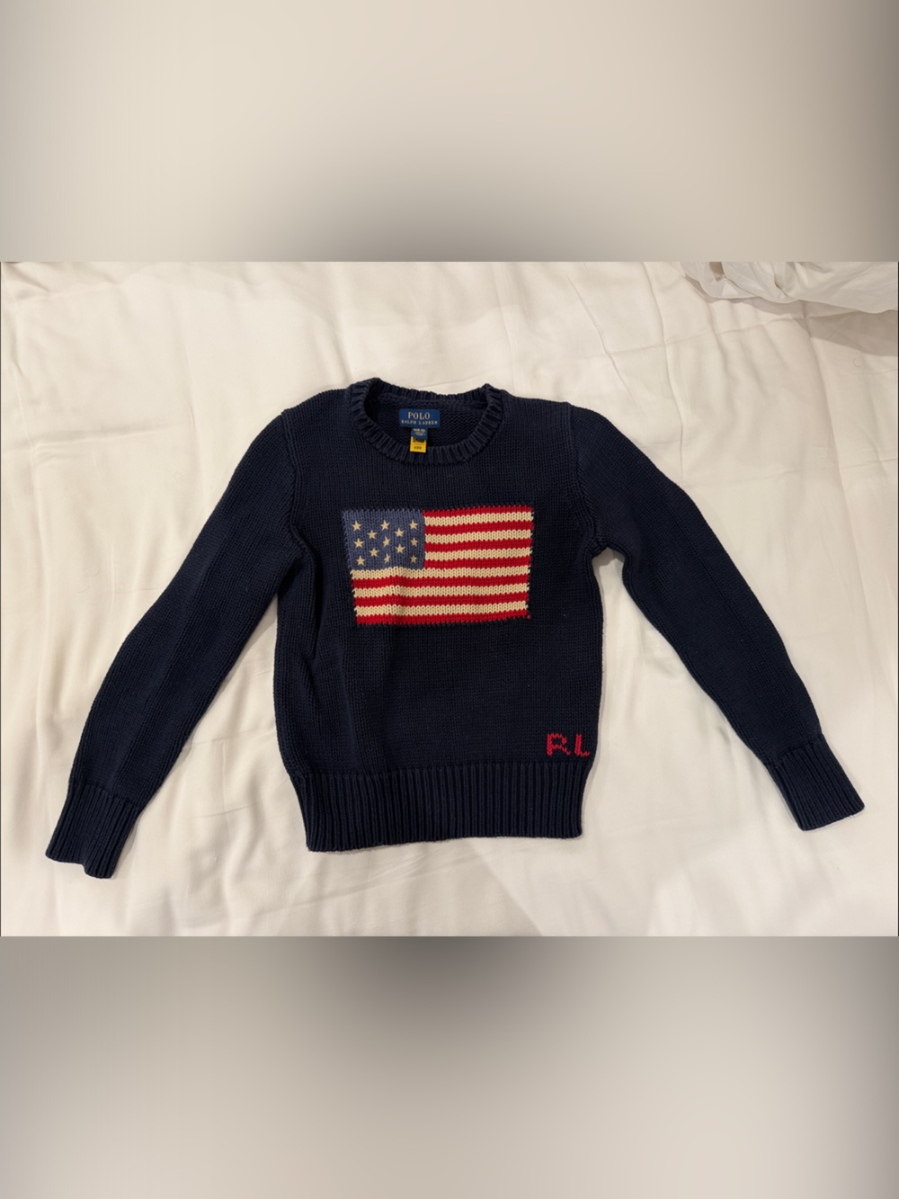 Polo by Ralph Lauren Navy Crewneck Sweater with Flag Motif

Size Medium (8-10)